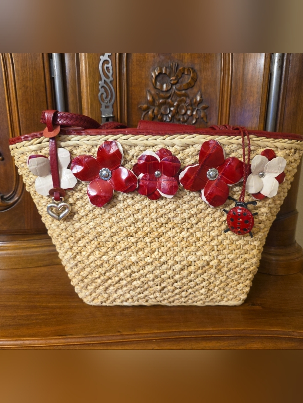 Brighton Woven Straw & Red Leather Trim Floral Appliques with Ladybug Charm Tote